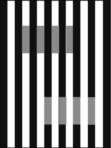 Figure 2: White’s Effect. The two sets of short bars have the same luminance (on screen) or reflectance (if printed) but because of the difference in background they appear to be at different grey levels, and to differ in their opacity/transparency. From Kingdom (2011).
